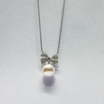 STERLING SILVER HALLMARKED ZIRCON BOW WITH PEARL DROP PENDENT WITH CHAIN