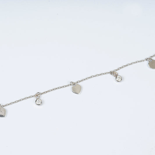 STERLING SILVER HALLMARKED ALTERNATE HEART AND ZIRCON CHARM BRACELET
