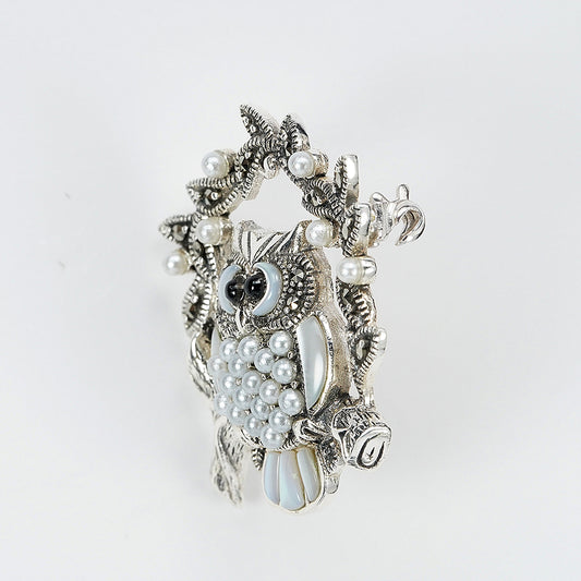 silver owl brooch with pearls and mother of pearls