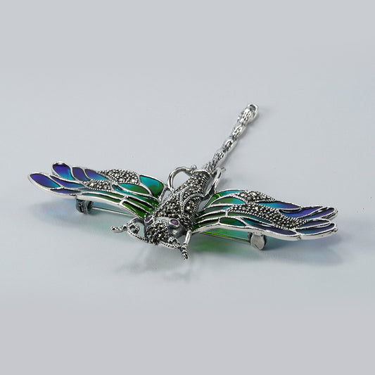 silver dragon fly brooch with oxidised finish and green and blue enamel