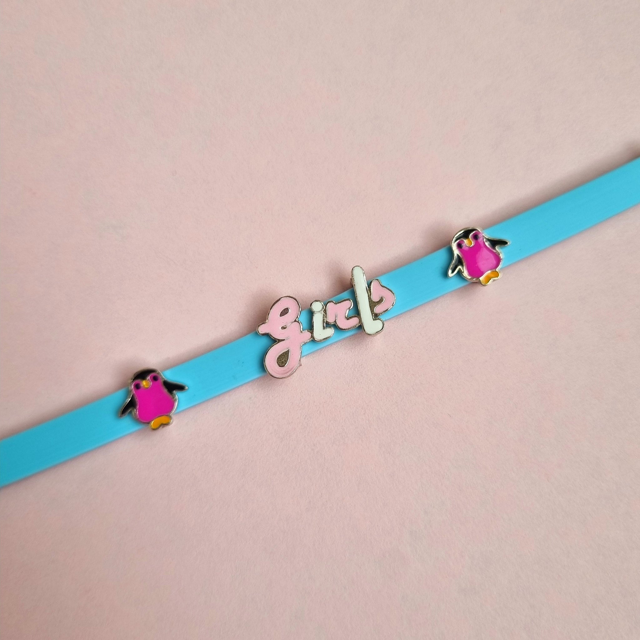 Sterling silver girls light blue bracelet with little penguin charm