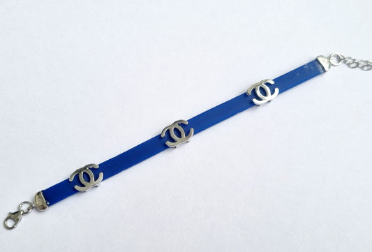 Sterling silver Chanel charm on blue bracelet for kids