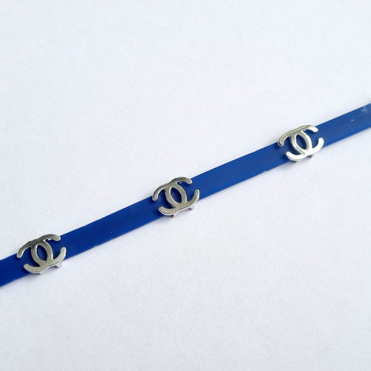 Sterling silver Chanel charm on blue bracelet for kids