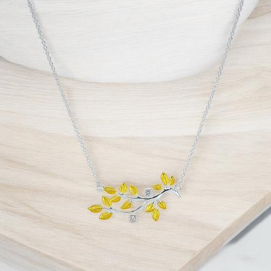 silver chain with gold plated branch out pendent studded with zircon