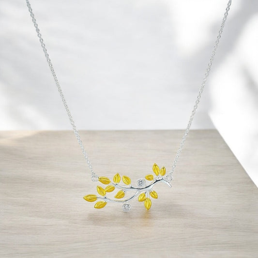 silver chain with gold plated branch out pendent studded with zircon