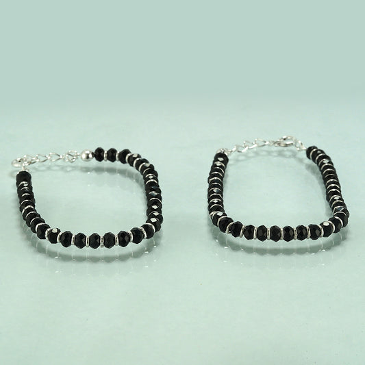 silver kid's anklet with black beeds