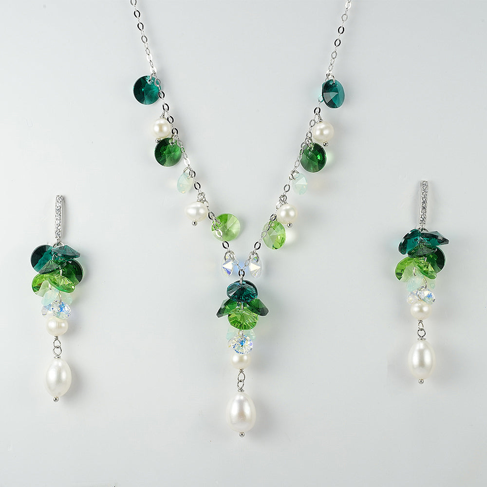 silver set with swarovski stones in the shades of green and pearls
