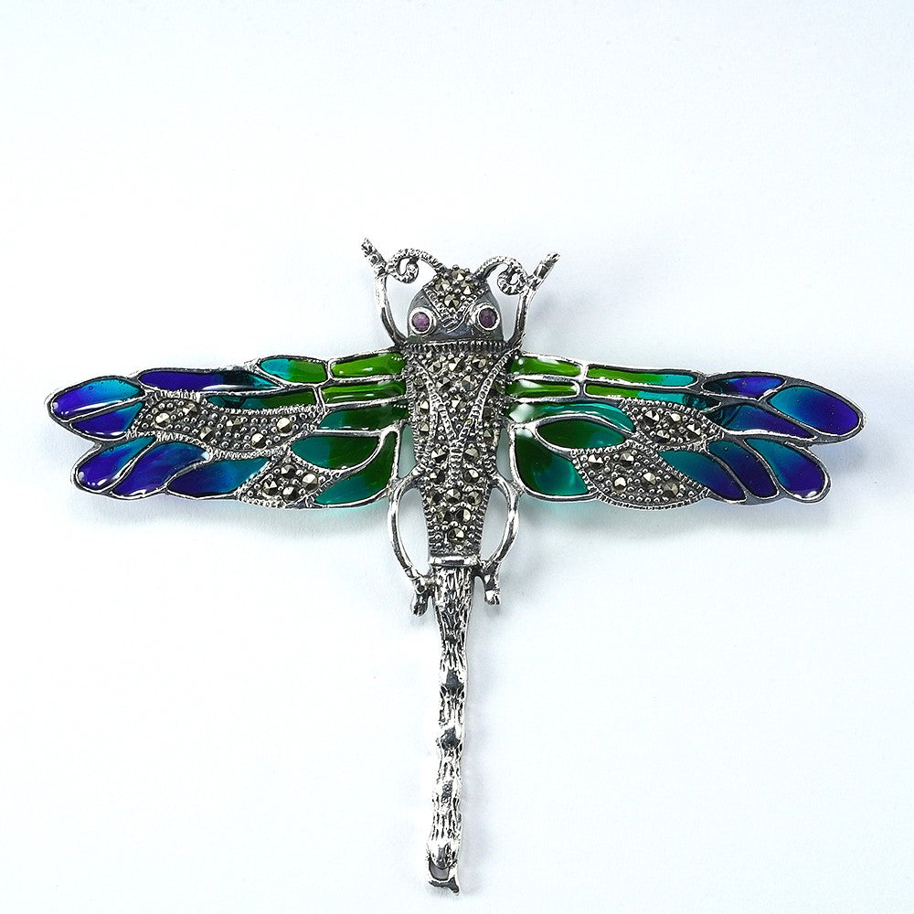 silver dragon fly brooch with oxidised finish and green and blue enamel