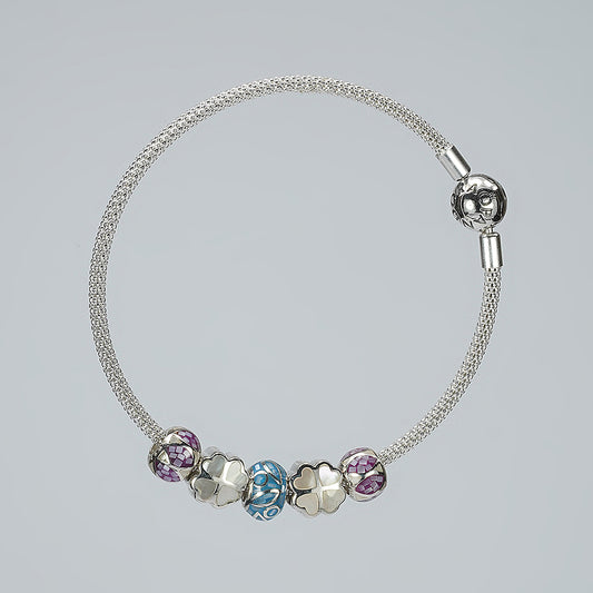 silver moving ball bracelet with blue white purple enamel