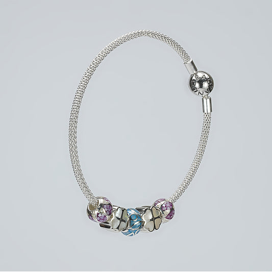 silver moving ball bracelet with blue white purple enamel