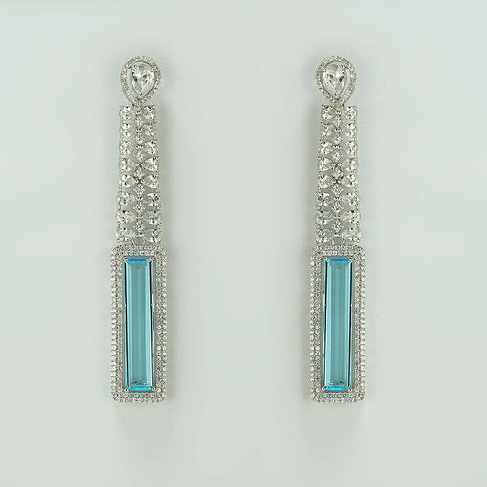 silver danglers studded with white and sky blue zircon