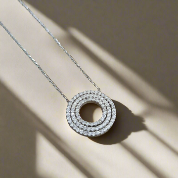 Sterling silver round patterned zirconia pendent and chain