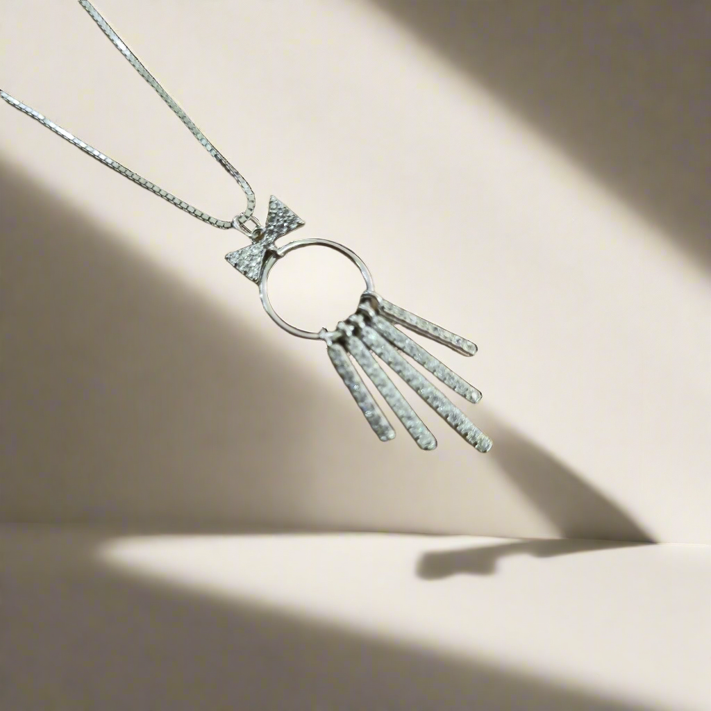 STERLING SILVER HALLMARKED BEADED DANGLING BOW WITH SPARKLING ZIRCONIA STONE PENDENT